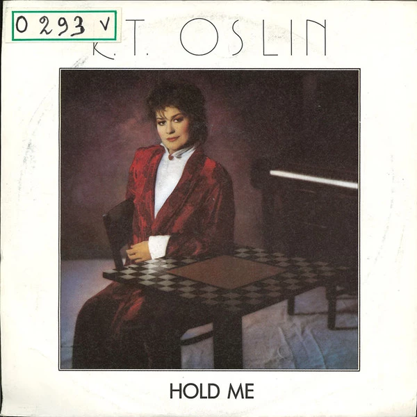 Hold Me / She Don't Talk Like Us No More